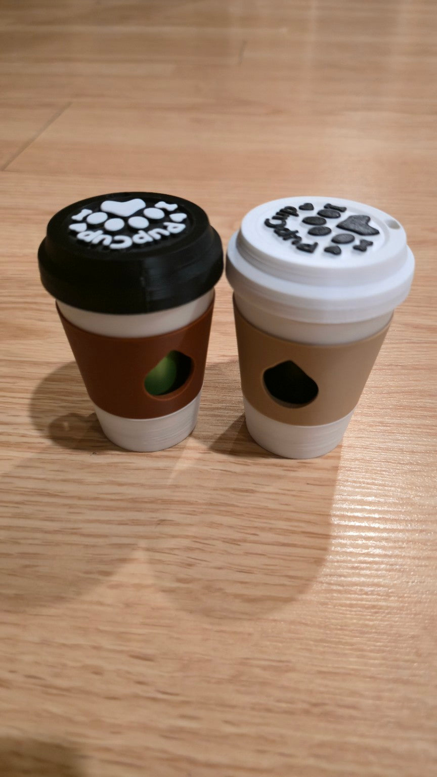 Coffee cup dog poop bag holders with black and white lids