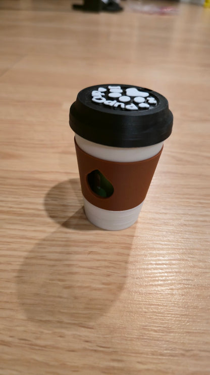 Brown coffee cup dog waste bag holder with black lid