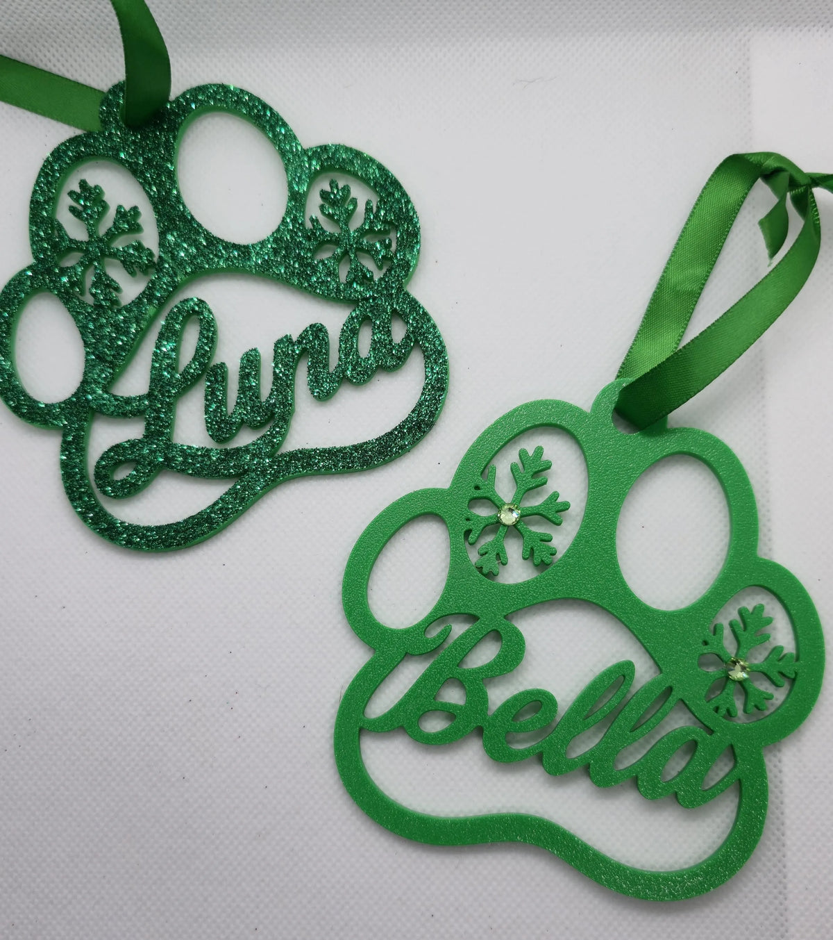 Paw print Christmas ornament personalized with a pet name