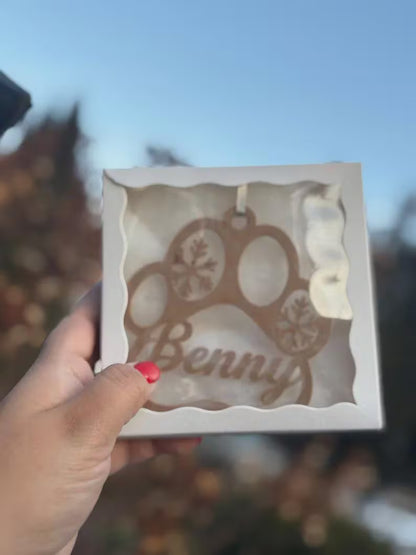 Paw print Christmas ornament personalized with a pet name