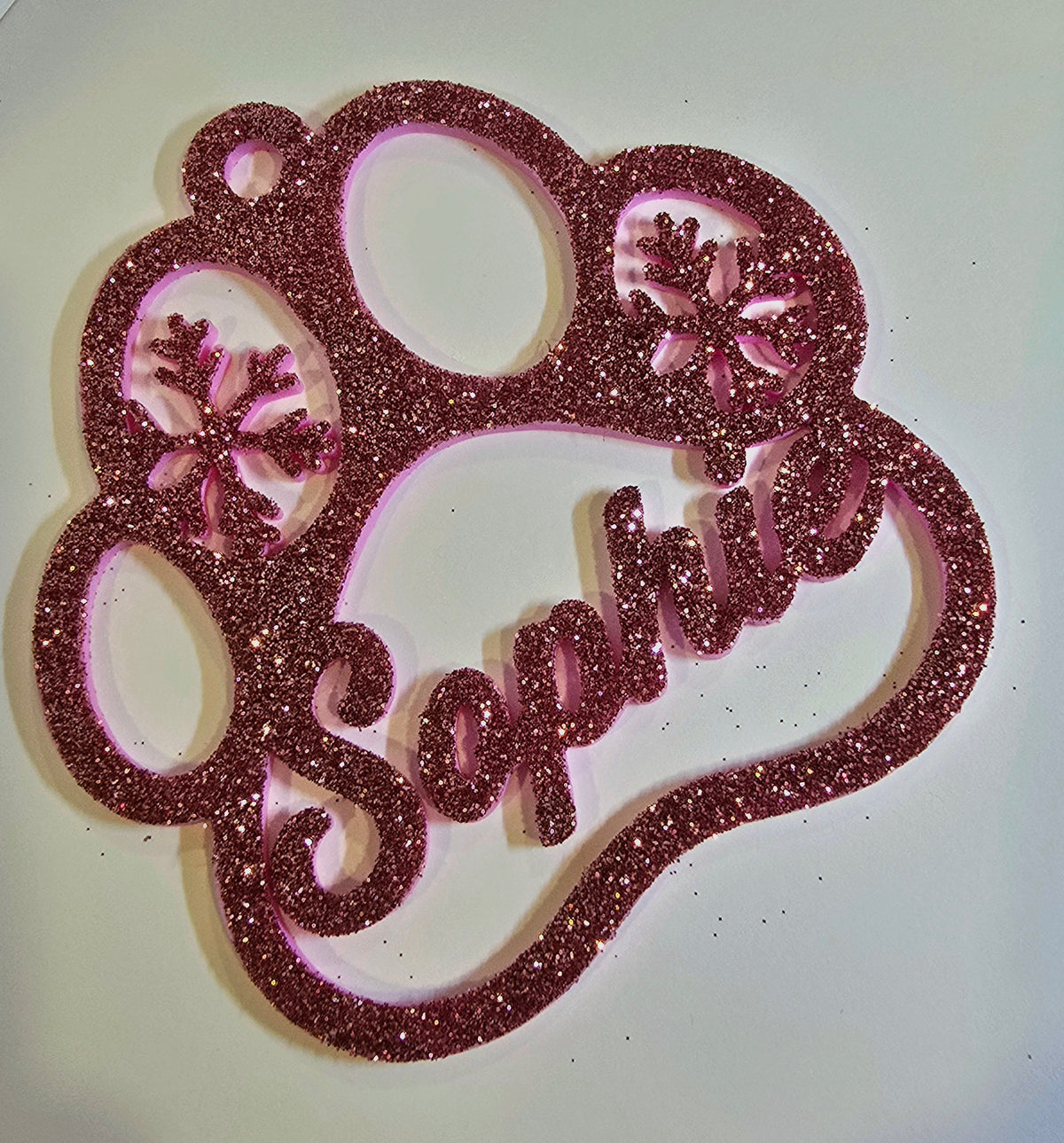 Pink paw print ornament with pet name